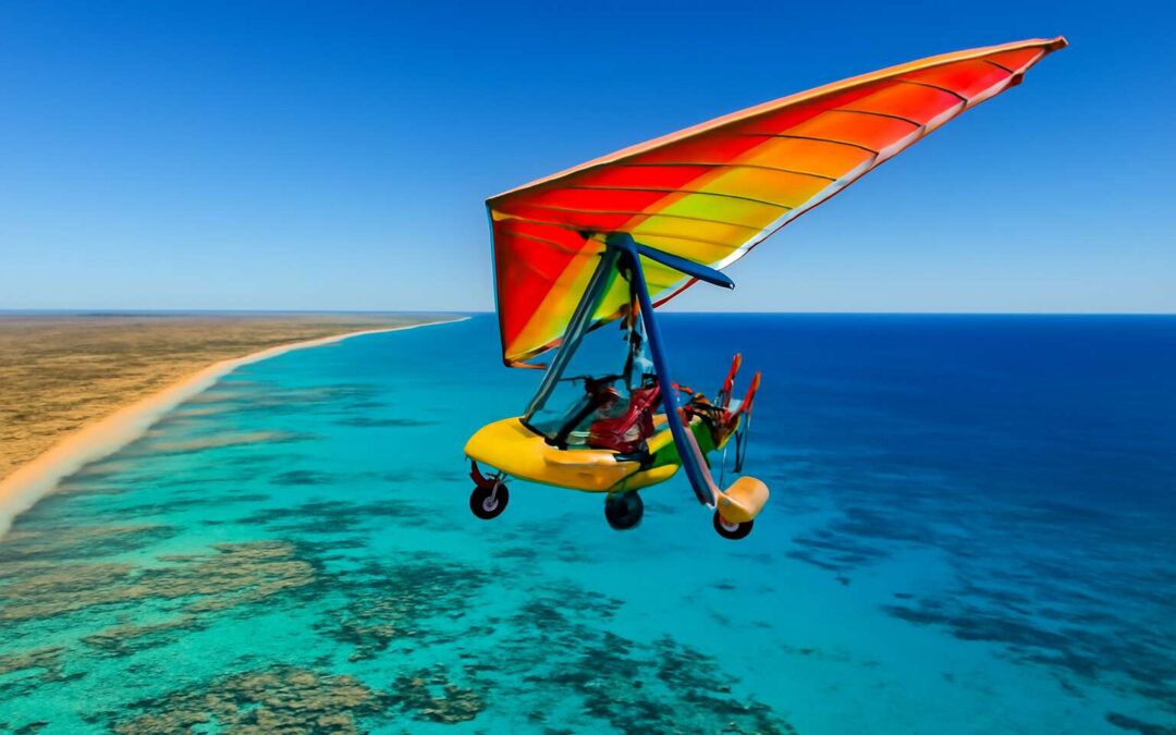 Glide over pristine shores: experience microlight exmouth like never before.